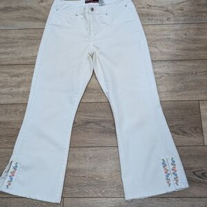 Elegant White Flare Jeans with Floral Detail